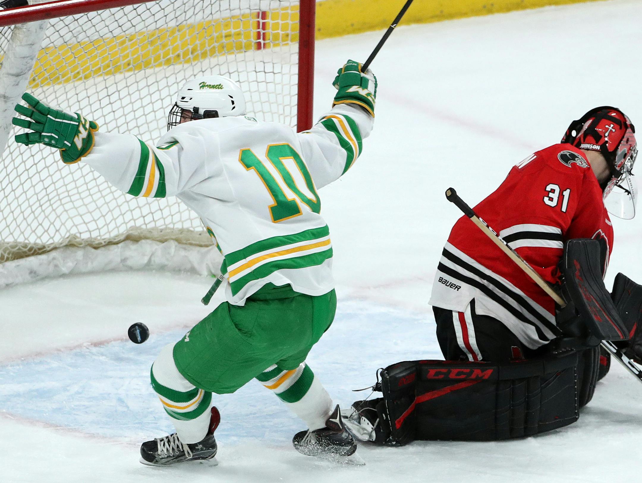 Edina High School center Sammy Walker (10) scored past Lakeville North High School goaltender Will Johnson (31) in the first period. ] ANTHONY SOUFFLE ï anthony.souffle@startribune.com Edina High School played Lakeville North High School in an Class 2A boys' hockey quarterfinals game Thursday, March 8, 2018 at the Xcel Energy Center in St. Paul, Minn.