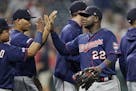 Minnesota Twins' Miguel Sano is congratulated by teammates after they defeated the Cleveland Indians in the second baseball game of a doubleheader, Sa