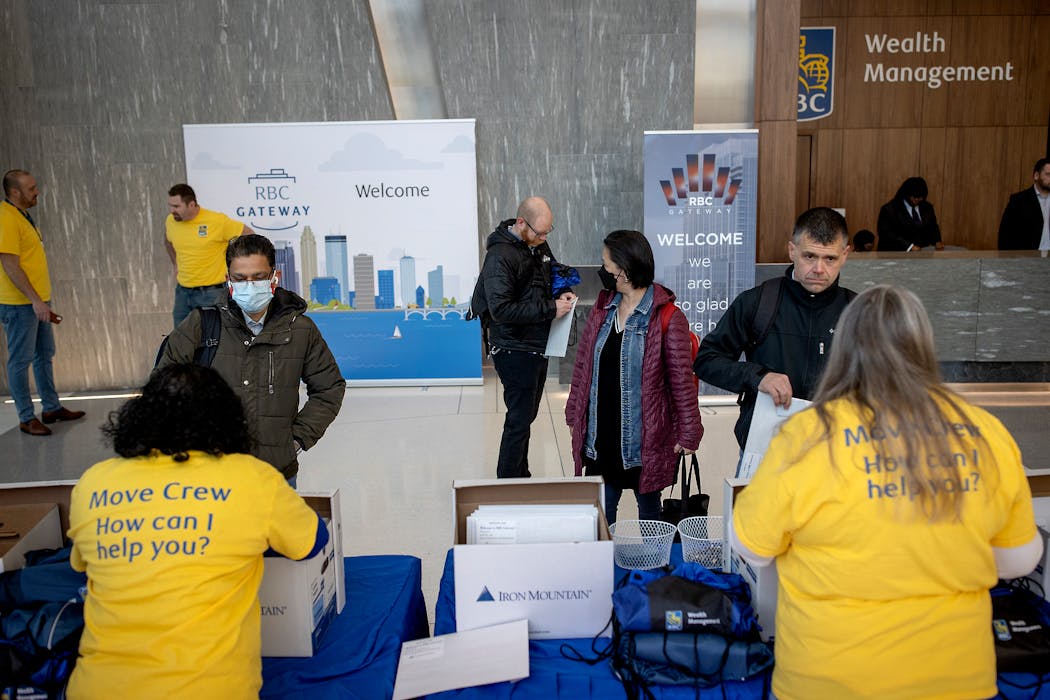 RBC Wealth Management employees picked up their badges and supplies as they moved into the RBC Gateway tower on Monday.