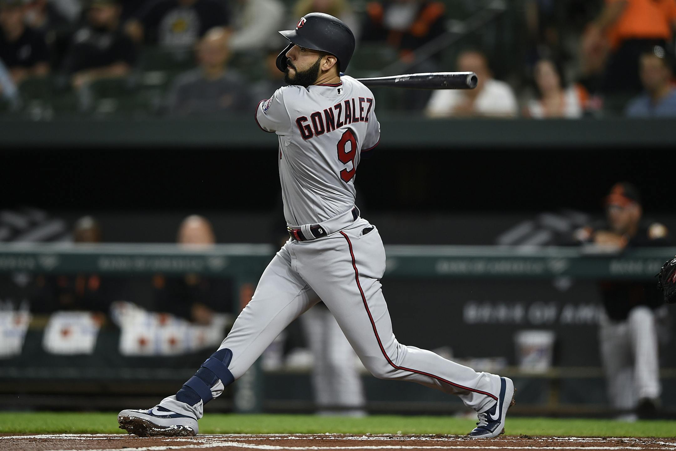 Minnesota Twins' Marwin Gonzalez follows through on a single against the Baltimore Orioles in the first inning of the second game of a baseball doubleheader, Saturday, April 20, 2019, in Baltimore.