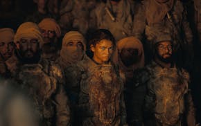 photo of Zendaya, surrounded by extras