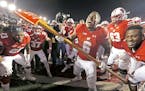 Wisconsin's running back Corey Clement took the Paul Bunyan's Axe to the goal post after Wisconsin defeated Minnesota 31-17 at Camp Randall Stadium, S