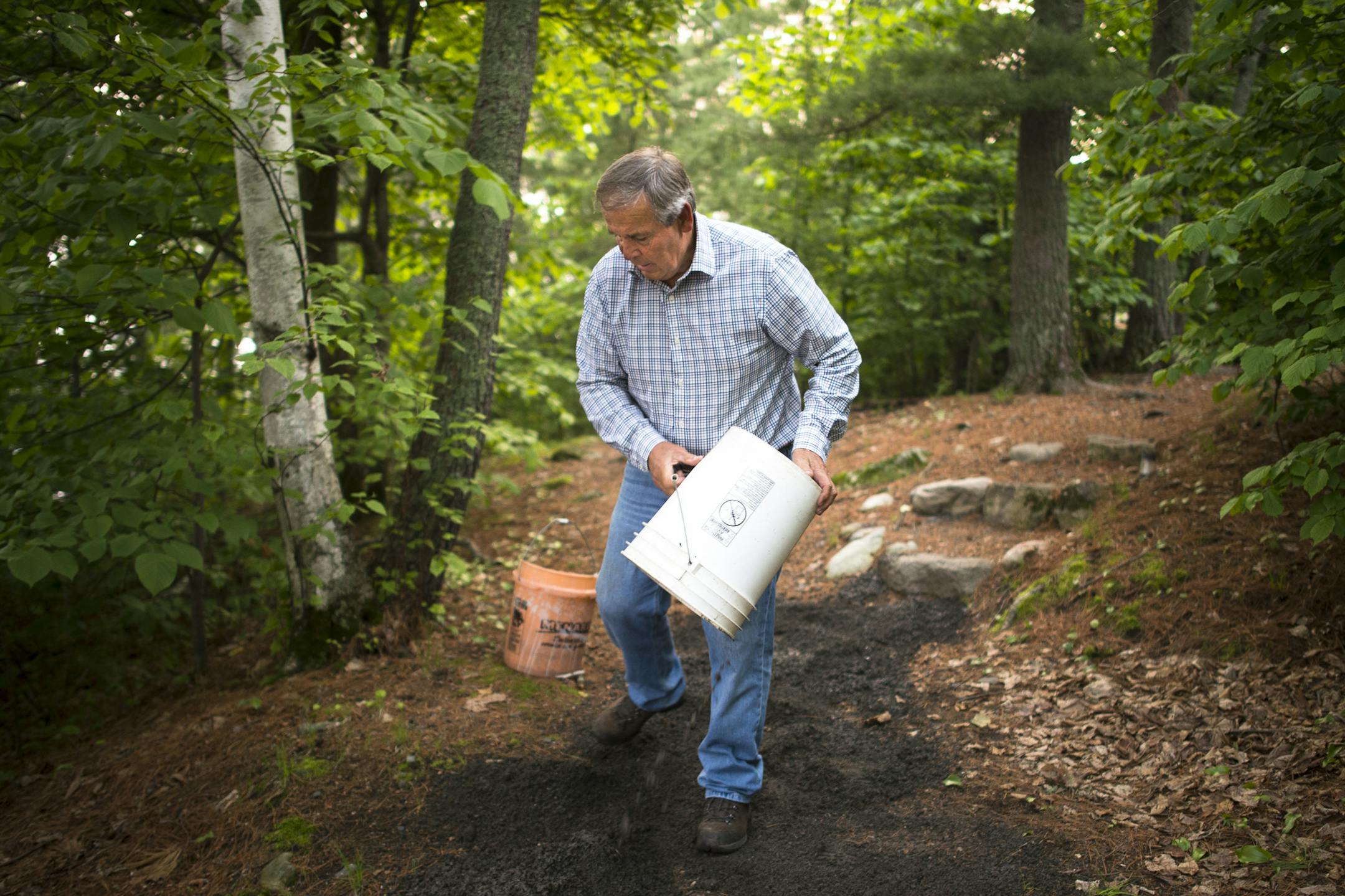 Logger and businessman Dennis Wagner touched up a trail with some rock outside one of his Rainy Lake properties in early June. ] Aaron Lavinsky • aaron.lavinsky@startribune.com Story on Ranier Mayor and businessman Dennis Wagner.