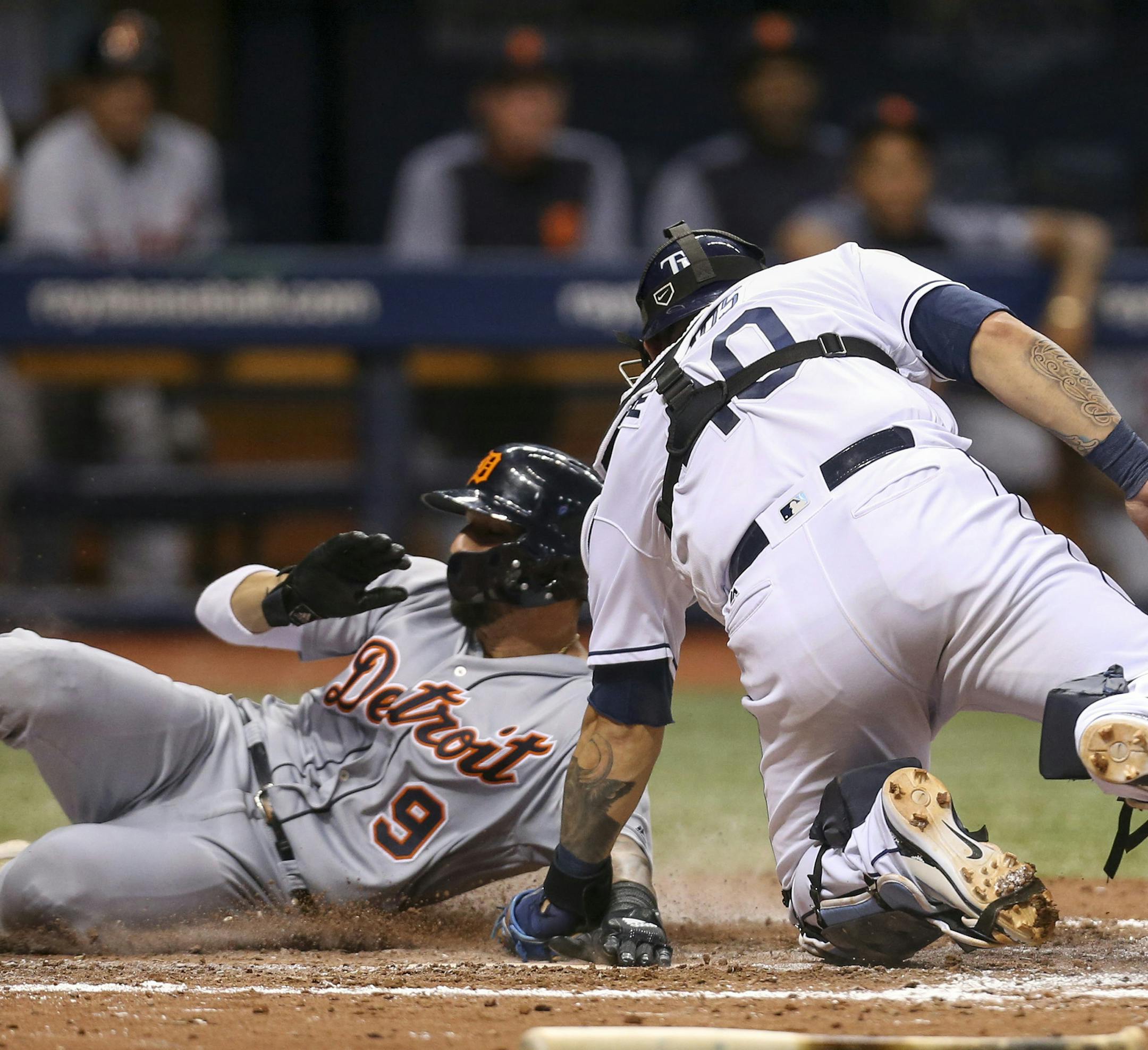Tampa Bay Rays catcher Wilson Ramos (40) applies the late tag without the ball as Detroit Tigers right fielder Nicholas Castellanos (9) scores in the seventh inning Monday, July 9, 2018 in St. Petersburg, Fla. (Chris Urso/Tampa Bay Times/TNS)