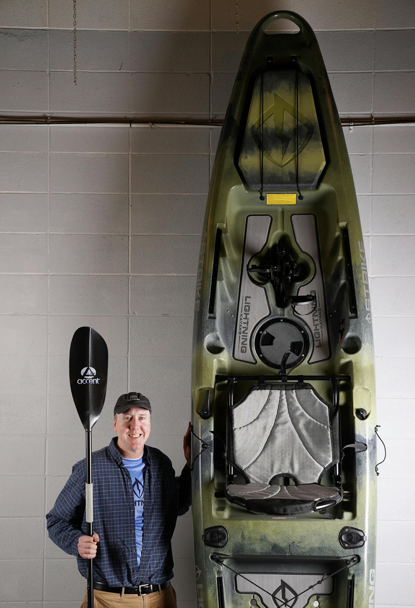 Stuart Lee, a co-owner of Accent/Cannon, makers of canoe, kayak and SUP paddles, stood for a portrait with his new Lightening Strike kayak Thursday. ] ANTHONY SOUFFLE &#x2022; anthony.souffle@startribune.com Stuart Lee, a co-owner of Accent/Cannon, makers of canoe, kayak and SUP paddles, stood for a portrait with his new Lightening Strike kayak Thursday, Jan. 31, 2019 at his production center in Minneapolis. Lee used an Indiegogo campaign to raise money for producing an all-new pedal kayak. Its