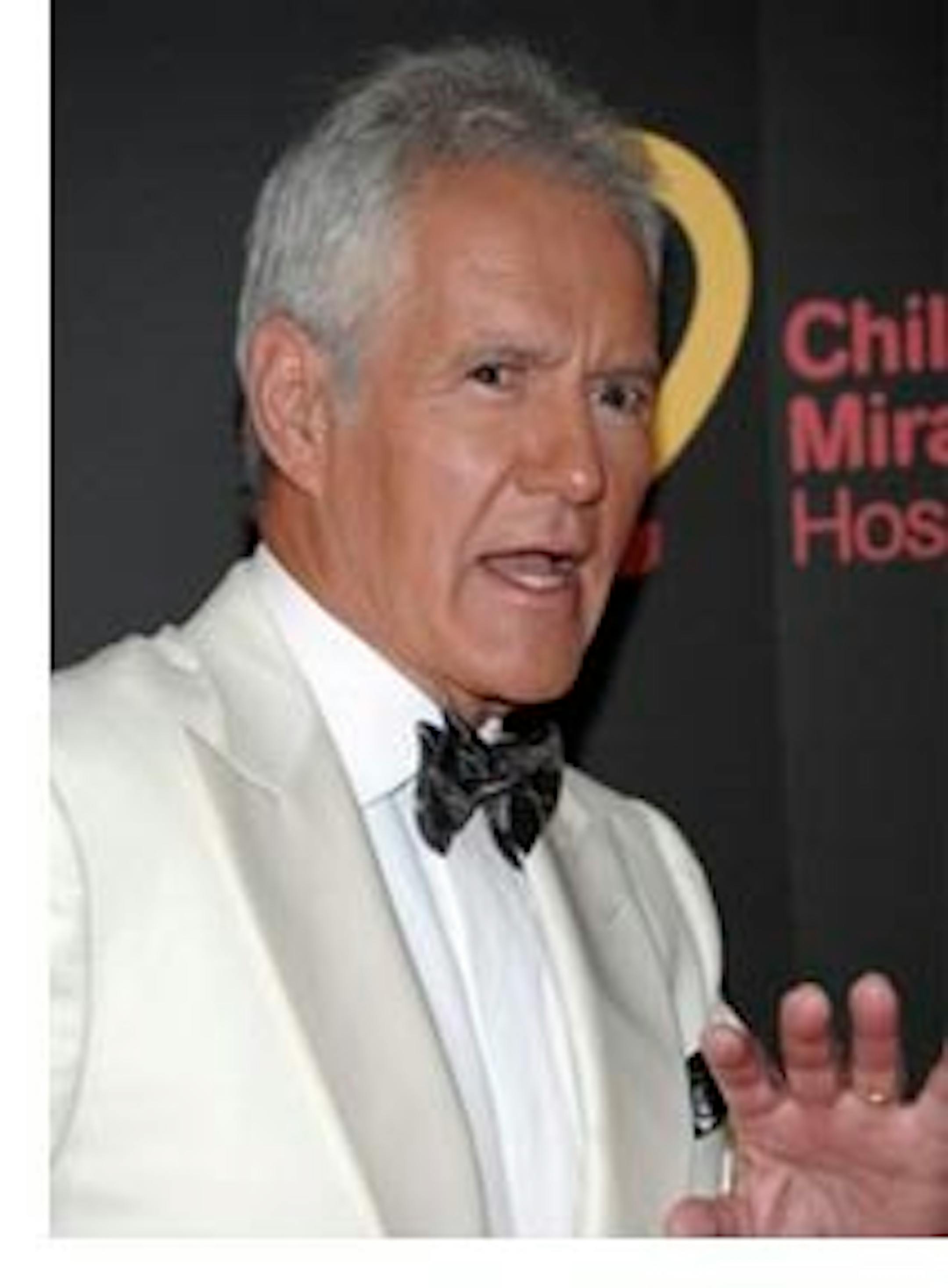 FILE - In this June 19, 2011 file photo, television personality Alex Trebek arrives at the 38th Annual Daytime Emmy Awards in Las Vegas. Trebek says he snapped his Achilles tendon while running after a burglar who had stolen cash, a bracelet and other items from his San Francisco hotel room. (AP Photo/Dan Steinberg, File)