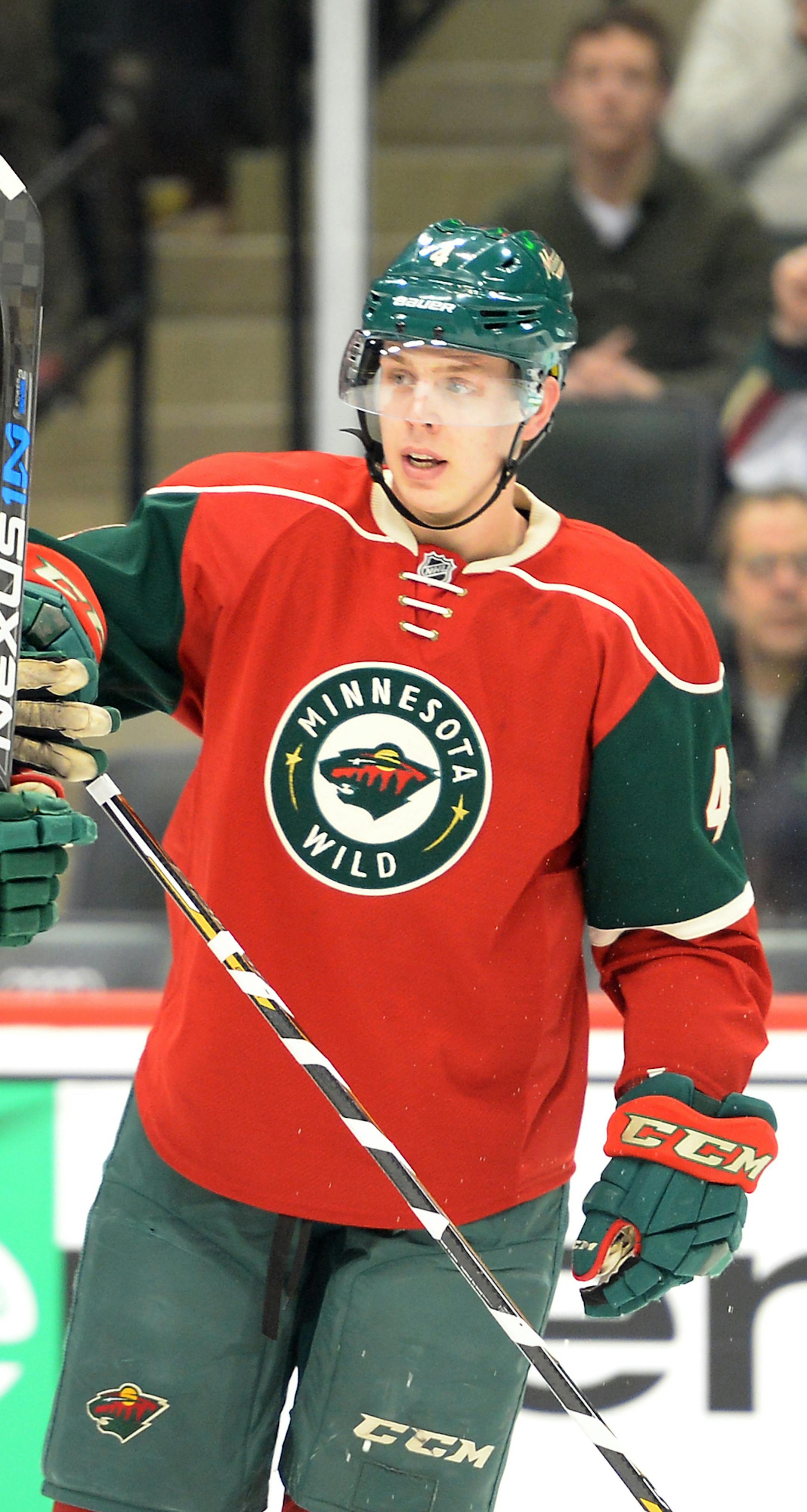 Minnesota Wild defenseman Nate Prosser (39) and Minnesota Wild defenseman Mike Reilly (4) celebrated Reilly's first career NHL goal late in the third period against Boston. ] (AARON LAVINSKY/STAR TRIBUNE) aaron.lavinsky@startribune.com The Minnesota Wild played the Boston Bruins on Saturday, Feb. 13, 2016 at Xcel Energy Center in St. Paul, Minn.
