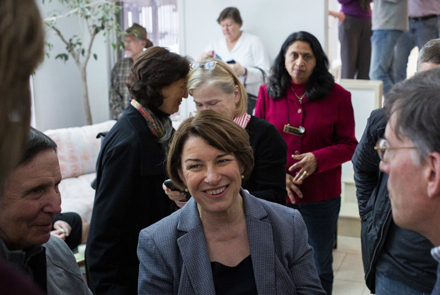 FILE &#x2014; Sen. Amy Klobuchar (D-Minn.), a Democratic presidential candidate, meets with supporters at a residence in Nashua, N.H., Feb. 24, 2019. Many Democratic presidential candidates have largely broken with consensus-driven politics and embraced progressive ideas on health care, taxes, the environment and Middle East policy. (Elizabeth Frantz/The New York Times)