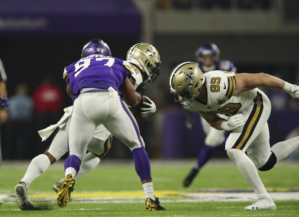 Minnesota Vikings defensive end Everson Griffen (97) tackled New Orleans Saints running back Mark Ingram (22) in the third quarter.