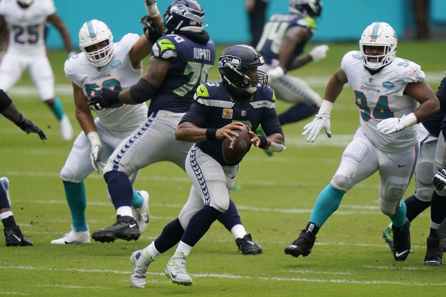 Seattle Seahawks quarterback Russell Wilson (3) runs with the ball during the first half of an NFL football game against the Miami Dolphins, Sunday, Oct. 4, 2020, in Miami Gardens, Fla. (AP Photo/Lynne Sladky)