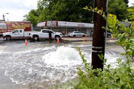 A water main break is seen at Joseph E. Boone Boulevard and James P. Brawley Drive in Atlanta on Friday, May 31, 2024.