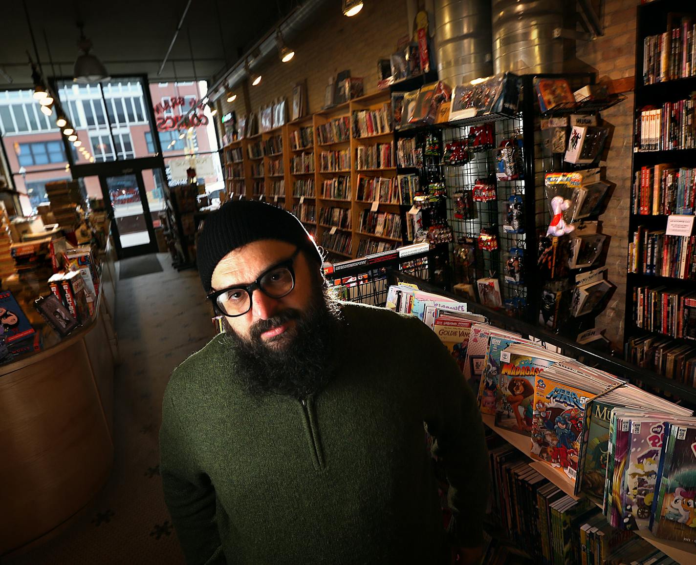 Michael Drivas, owner of Big Brain Comics in downtown Minneapolis. The much loved comic book store will close its doors after 20 years in late June.