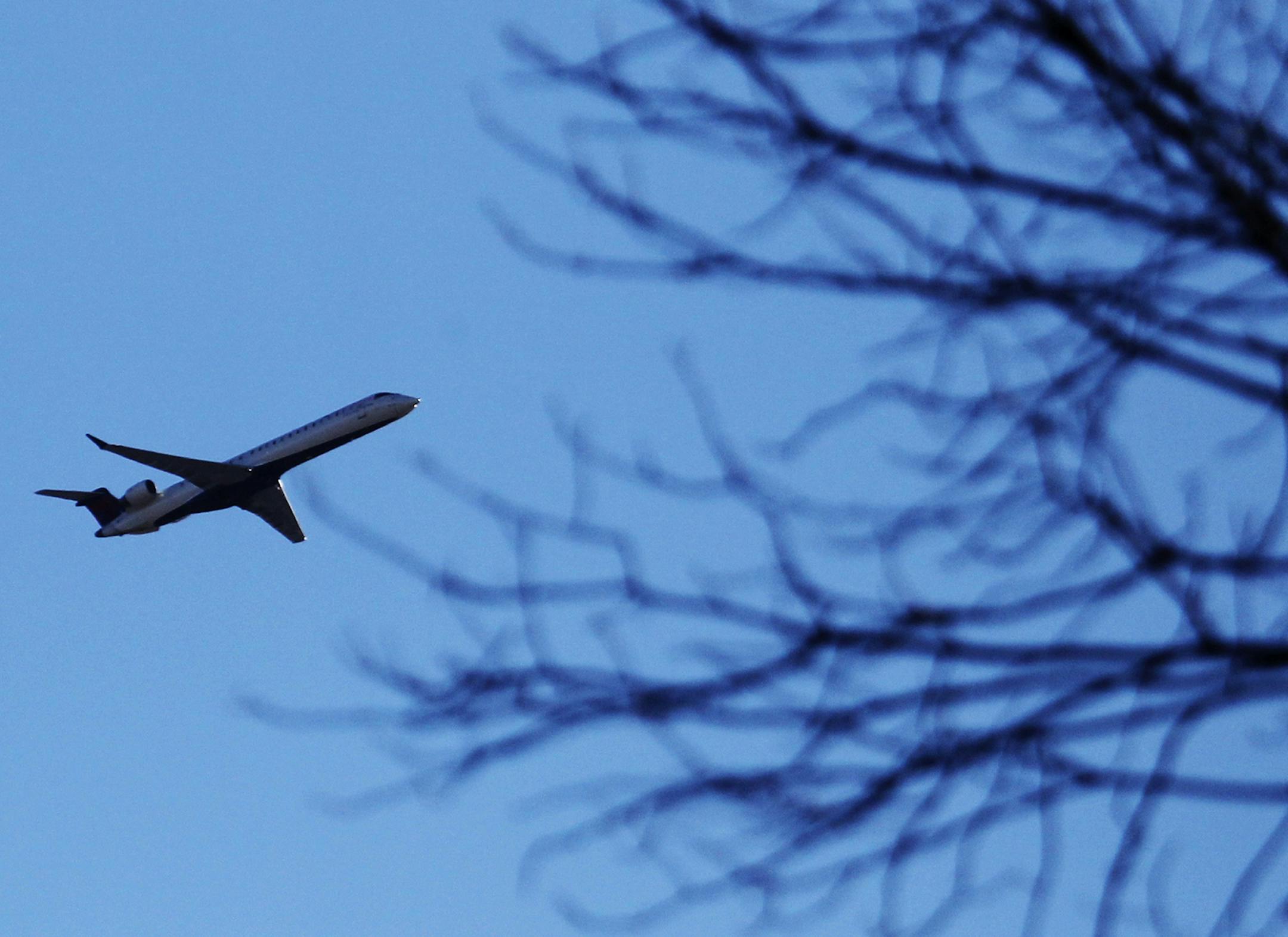 A plane that took off from MSP cruises over a Southwest Minneapolis neighborhood near the Crosstown and Oliver Ave. S Wednesday, Oct. 31, 2012, in Minneapolis, MN.] (DAVID JOLES/STARTRIBUNE) djoles@startribune.com A new technology for guiding takeoffs from Minneapolis-St. Paul International Airport will create winners and losers in the fight over plane noise by concentrating more traffic over freeways, a river basin and some neighborhoods. The airports commission this month will consider whether
