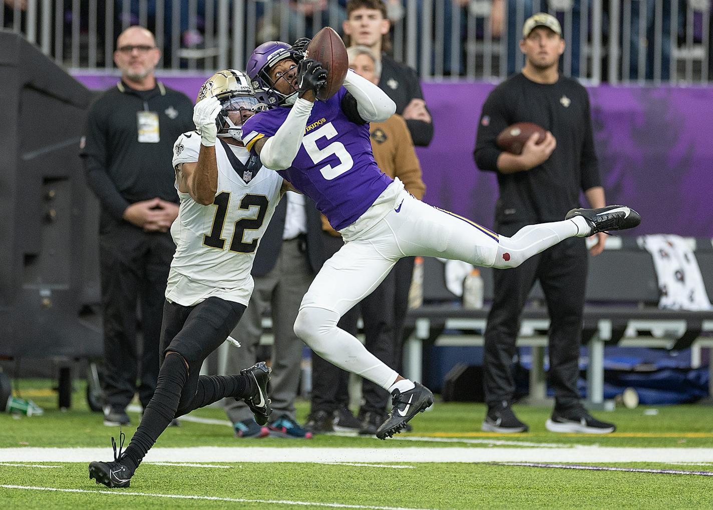 Vikings cornerback Mekhi Blackmon (5) intercepts a pass intended for Saints wide receiver Chris Olave (12) during the fourth quarter at U.S. Bank Stadium in Minneapolis, Minn., on Friday, Nov. 10, 2023.   ] Elizabeth Flores • liz.flores@startribune.com