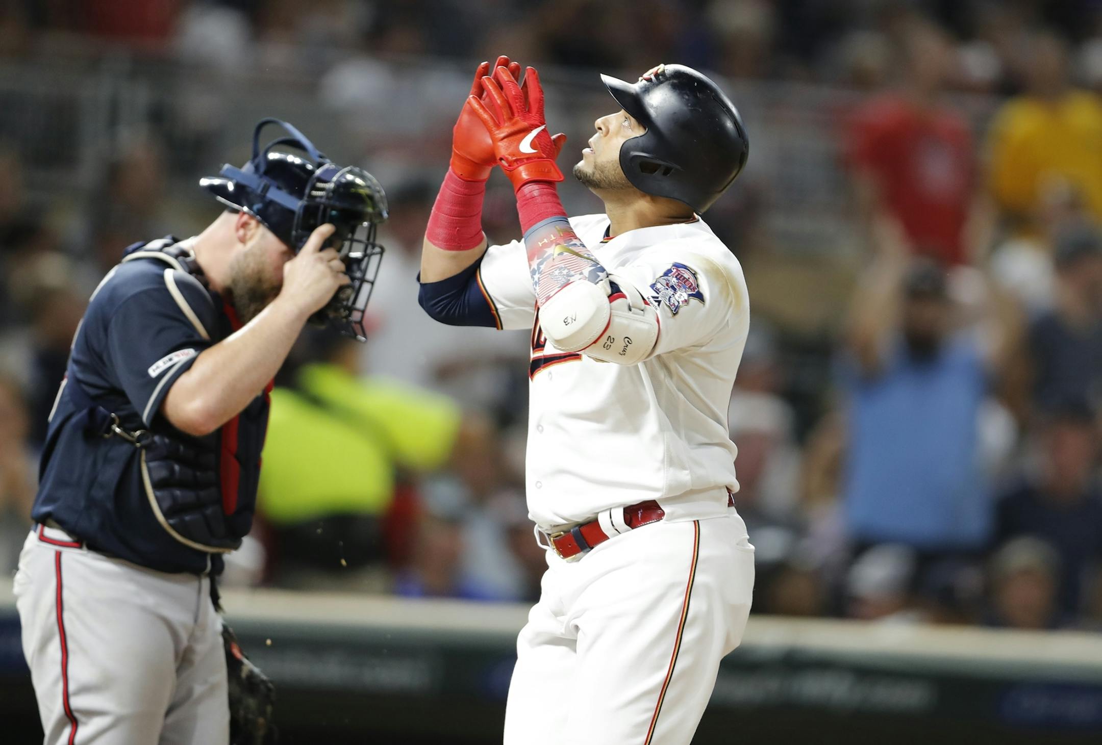 Minnesota Twins designated hitter Nelson Cruz (23) celebrates a home run in the seventh inning.
