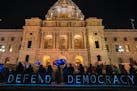 Supporters of The Spotlight on Democracy rally on the steps of the State Capitol in St. Paul, Minn., on Thursday, Jan. 6, 2022. Minnesotans will rally