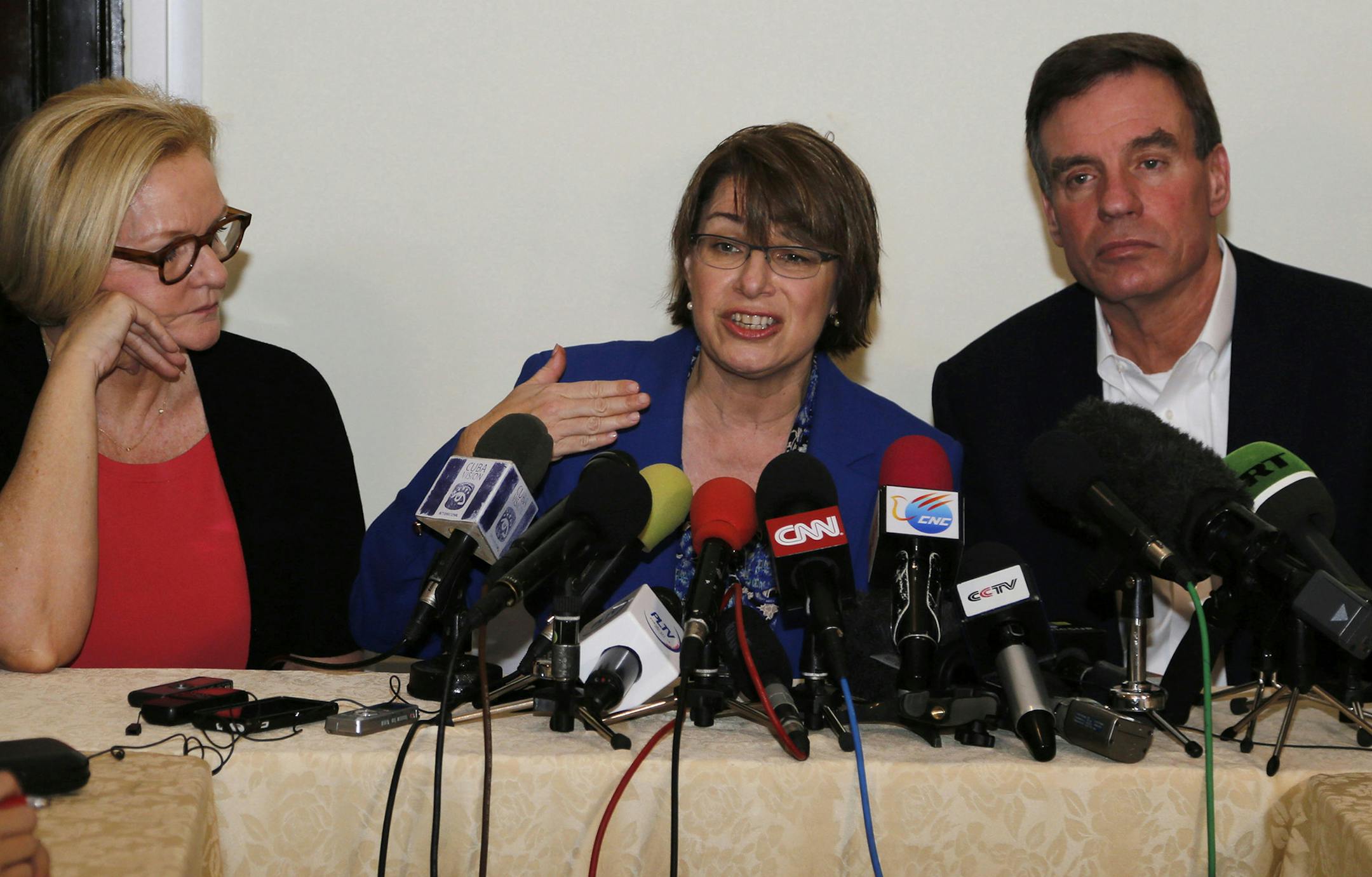 Senator Amy Klobuchar of Minnesota speaks during a press conference with fellow senators Claire McCaskill of Missouri, left, and Mark Warner of Virginia in Havana, Cuba, Tuesday, Feb. 17, 2015. The delegation is in Cuba in support of a bill Klobuchar is sponsoring to lift the U.S. trade embargo on Cuba. According to the senators, a new round of negotiations to restore full diplomatic ties with Cuba will take place next week in Washington. (AP Photo/Desmond Boylan) ORG XMIT: MIN2015021721254877