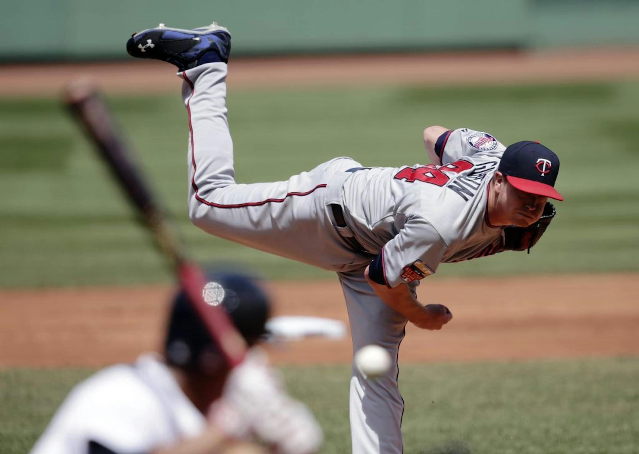 Minnesota Twins starting pitcher Kyle Gibson delivers to the Boston Red Sox during the first inning of a baseball game at Fenway Park in Boston, Wednesday, June 18, 2014.