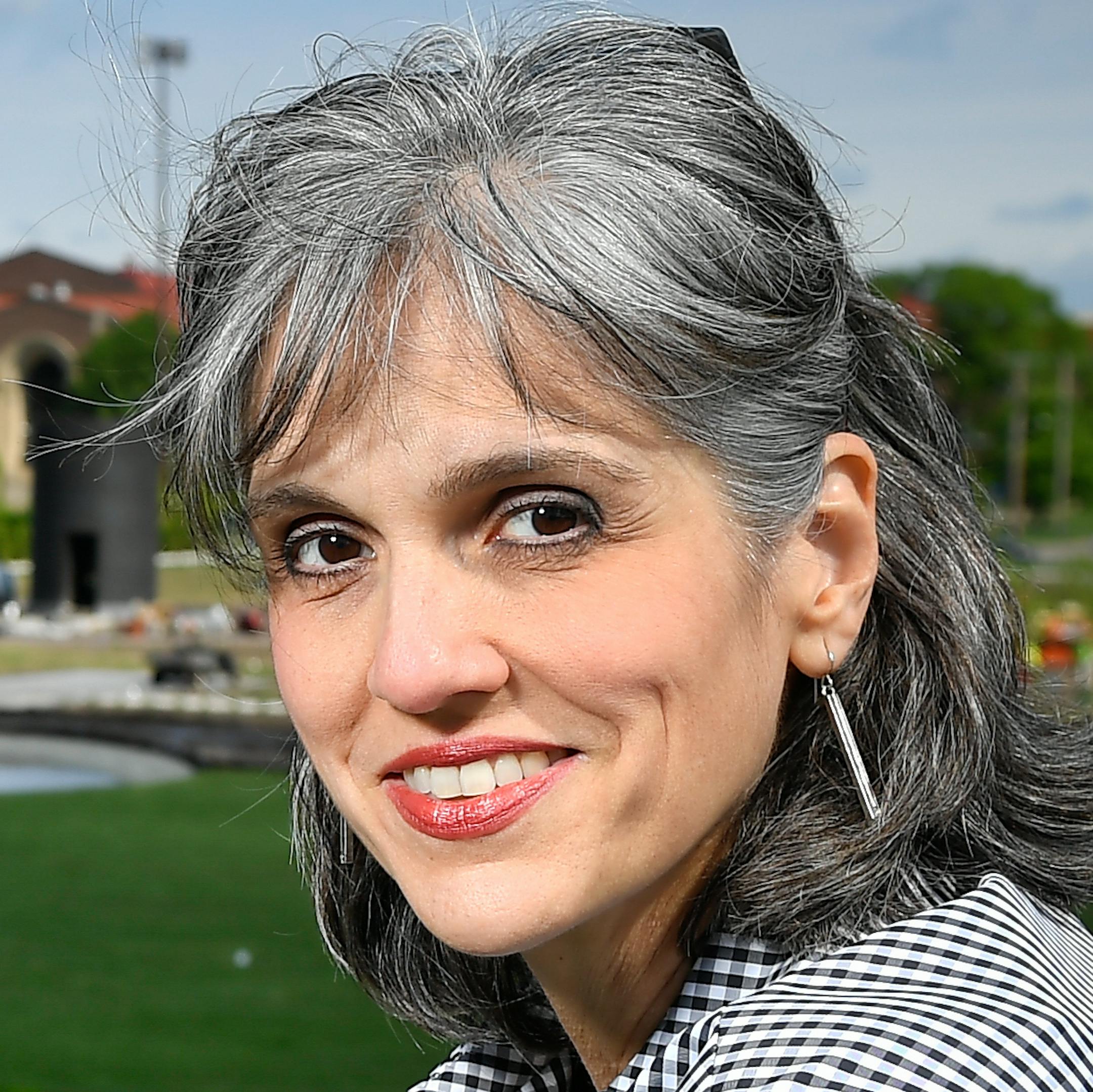 Walker Art Center director Olga Viso was photographed Monday morning at the Minneapolis Sculpture Garden. ] AARON LAVINSKY ï aaron.lavinsky@startribune.com Walker Art Center director Olga Viso set herself a big task with the renovation of the Minneapolis Sculpture Garden that opens this week. Her aim is to bring coherence and more visitors -- to the Walker's sprawling campus, while also connecting it with downtown Minneapolis as part of a long-envisioned cultural corridor. It's a civic plan