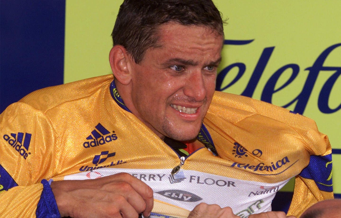 France's Jacky Durand puts on the yellow jersey after becoming the new leader after the 1st stage of the Tour of Spain cycling race in Benidorm, southern Spain, Sunday Sept. 5, 1999. (AP Photo/Denis Doyle) ORG XMIT: XMUR104