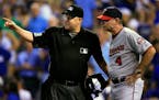 Home plate umpire Todd Tichenor, left, explained a call to Twins manager Paul Molitor during a game against the Kansas City Royals at Kauffman Stadium