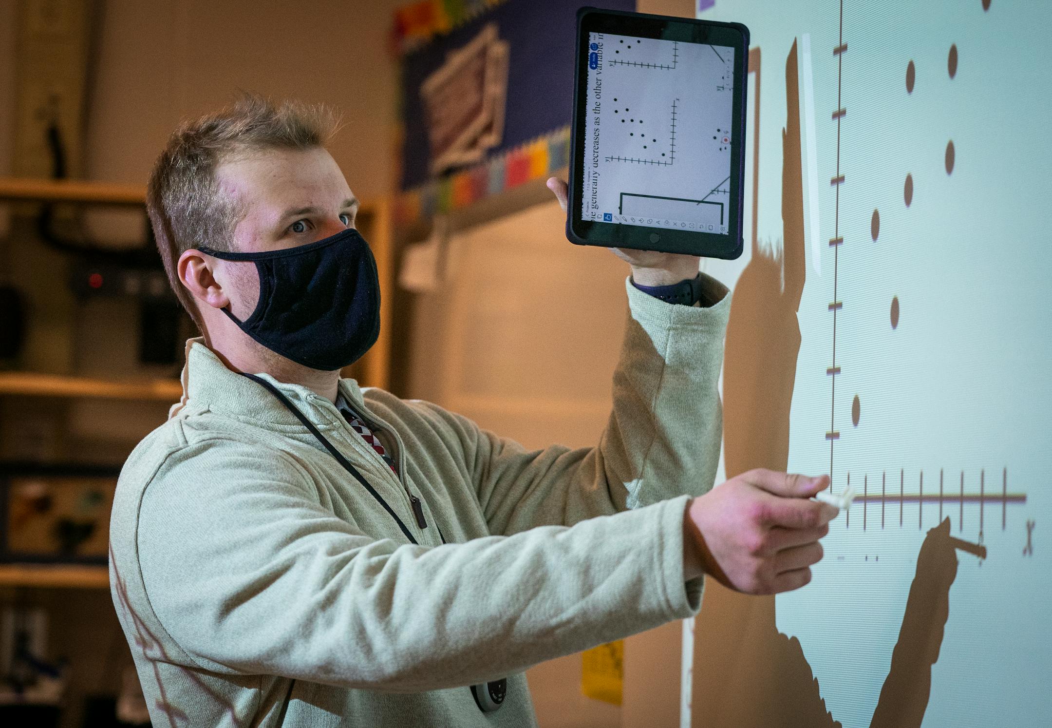 Student teacher Sam Carver teaches middle school algebra class at Jackson Middle School in Champlin.