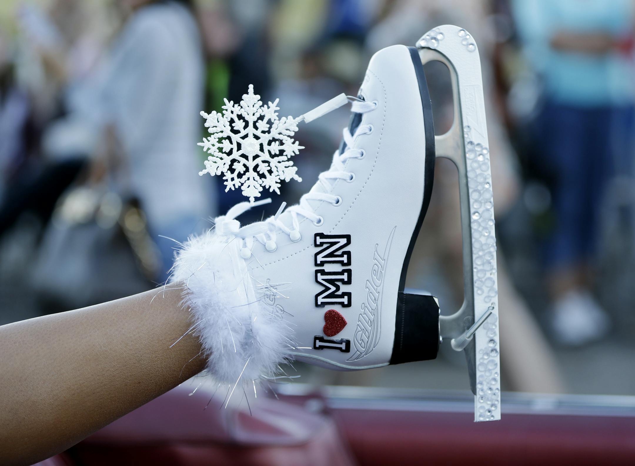 Miss Minnesota Rebecca Yeh displays her shoe during the Miss America Shoe Parade at the Atlantic City boardwalk, Saturday, Sept. 14, 2013, in Atlantic City, N.J. (AP Photo/Julio Cortez)