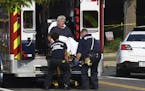Rep. Roger Williams, R-Texas is placed into an ambulance at the scene of a shooting at a baseball field in Alexandria, Va., Wednesday, June 14, 2017. 