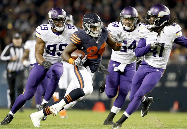 Jordan Howard (24) was chased by Danielle Hunter (99) Eric Kendricks (54) and Anthony Harris (41) during a run after catching a shovel pass in the sec