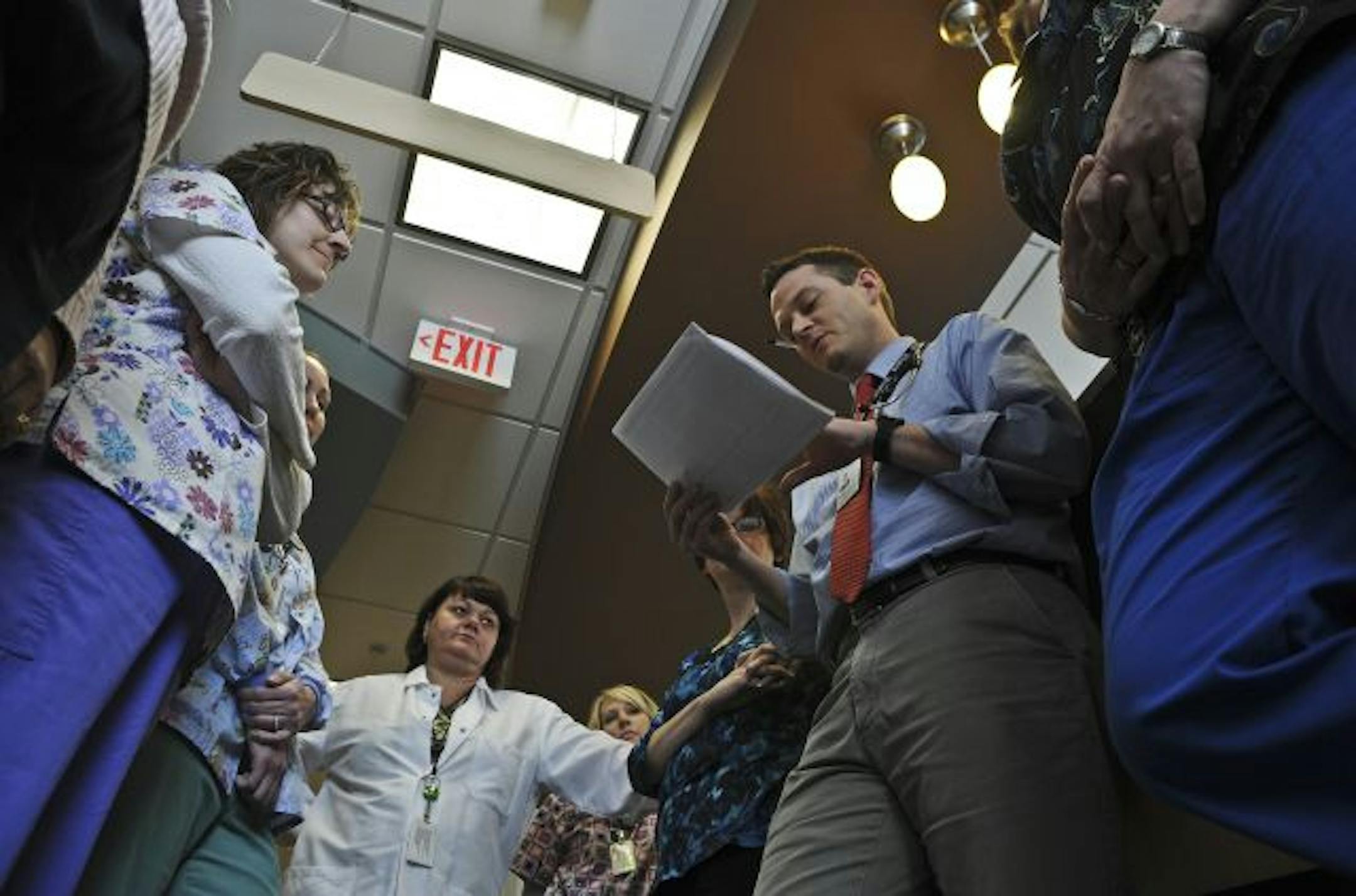 The Fairview Rosemount Clinic is pioneering outcome-based patient care to meet the "accountable care" requirements of health reform. As part of the program, the staff huddles up to twice a day to discuss patient care. Dr. Jacob Wasson led the meeting and the talks about patient outcomes.
