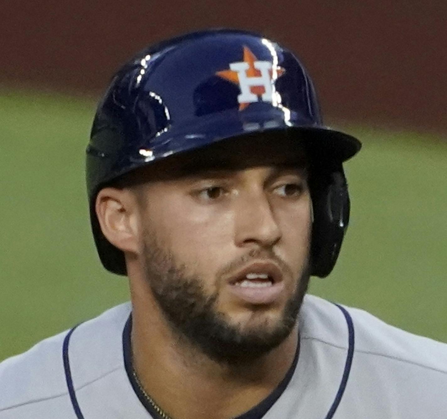 Houston Astros' George Springer takes a lead off of first in the first inning of a baseball game against the Texas Rangers in Arlington, Texas, Friday, Sept. 25, 2020. (AP Photo/Tony Gutierrez)