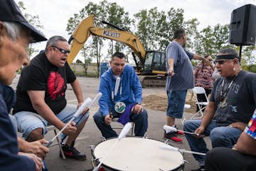 The Red Lake Singers drum and sing during the ceremony. From left is Chief Greeting Spears, Mike Thunder, Keith Bedeau, Virgil Blacklance, and Sam Str