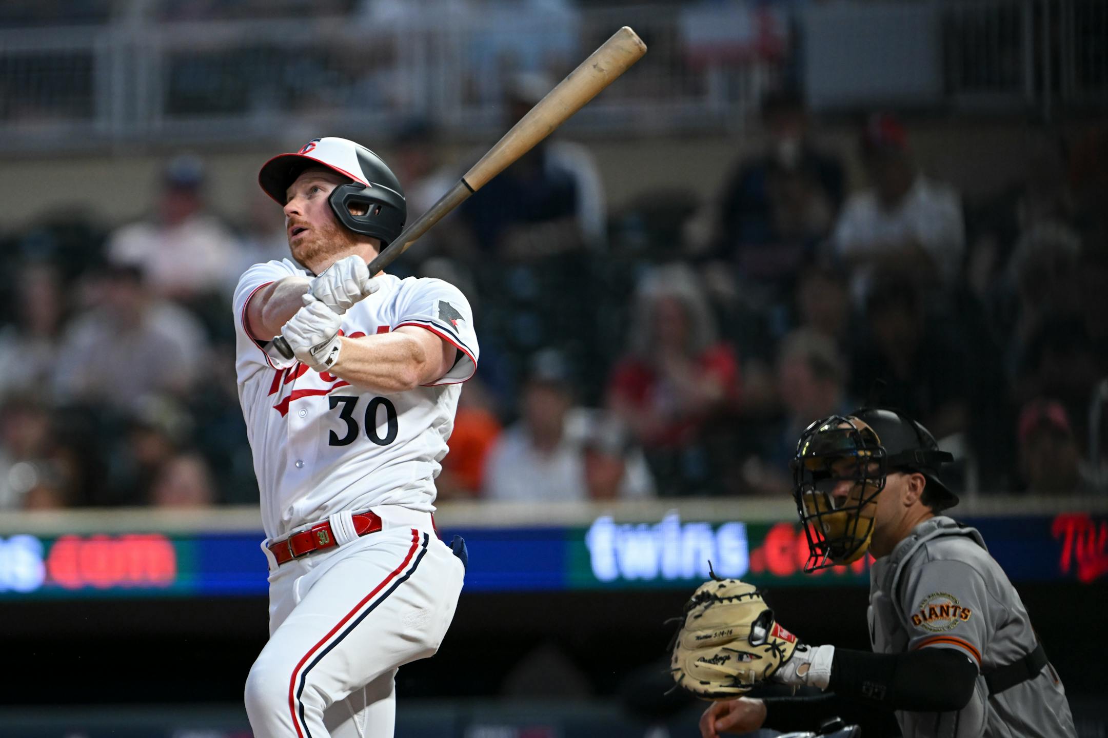 Minnesota Twins left fielder Kyle Garlick follows through with his swing after hitting a solo home run against the San Francisco Giants in the bottom of the eighth inning.