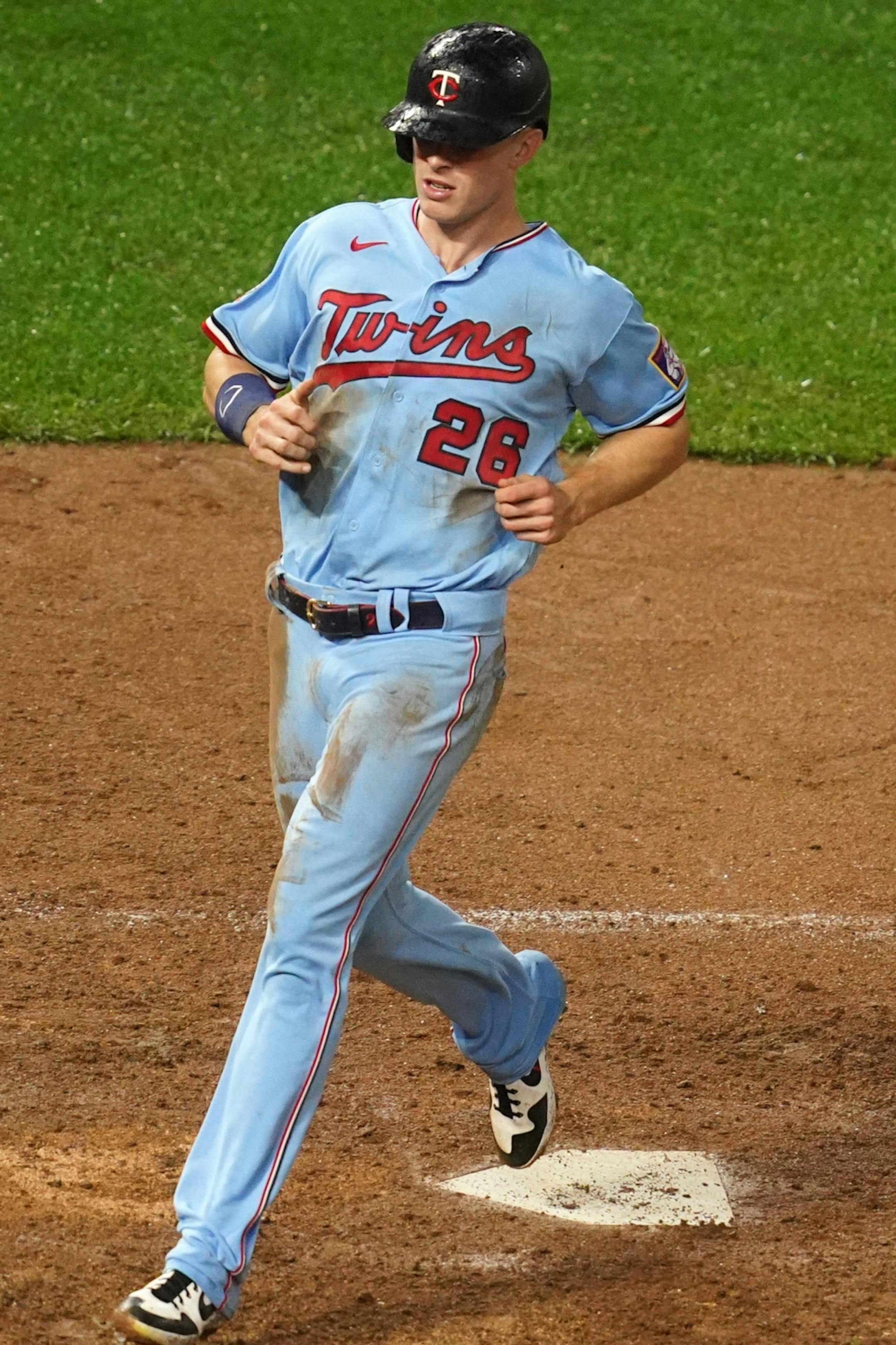 Minnesota Twins right fielder Max Kepler (26) scored on a sacrifice double play off a ball hit by Minnesota Twins left fielder Eddie Rosario (20) in the seventh inning.