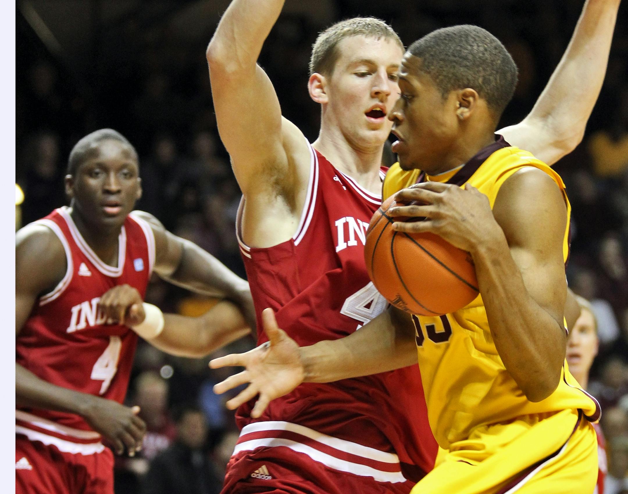 Indiana's Cody Zeller (center), Gophers forward Rodney Williams