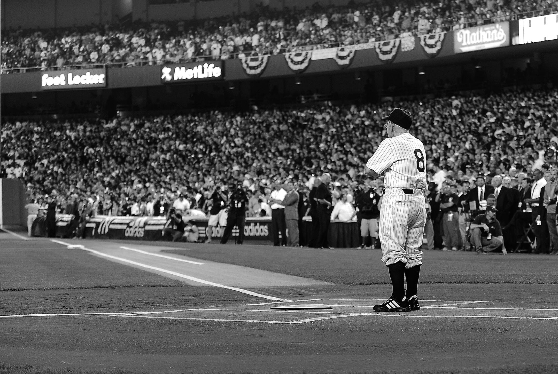 FILE &#xf3; Yogi Berra stands by home plate in a ceremony before the final home game at the old Yankee Stadium, in New York, Sept. 21, 2008. Berra, one of baseball&#xed;s greatest characters and a mainstay on 10 Yankees championship teams, died on Tuesday, Sept. 22, 2015. He was 90. (Barton Silverman/The New York Times) ORG XMIT: MIN2015092320025512