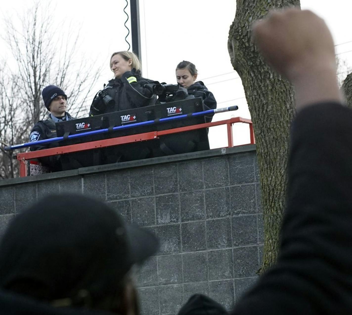 At the 4th Precinct in North Minneapolis, police recorded protesters who continued to demand answers over the death of Jamar Clark who was shot and killed by police .