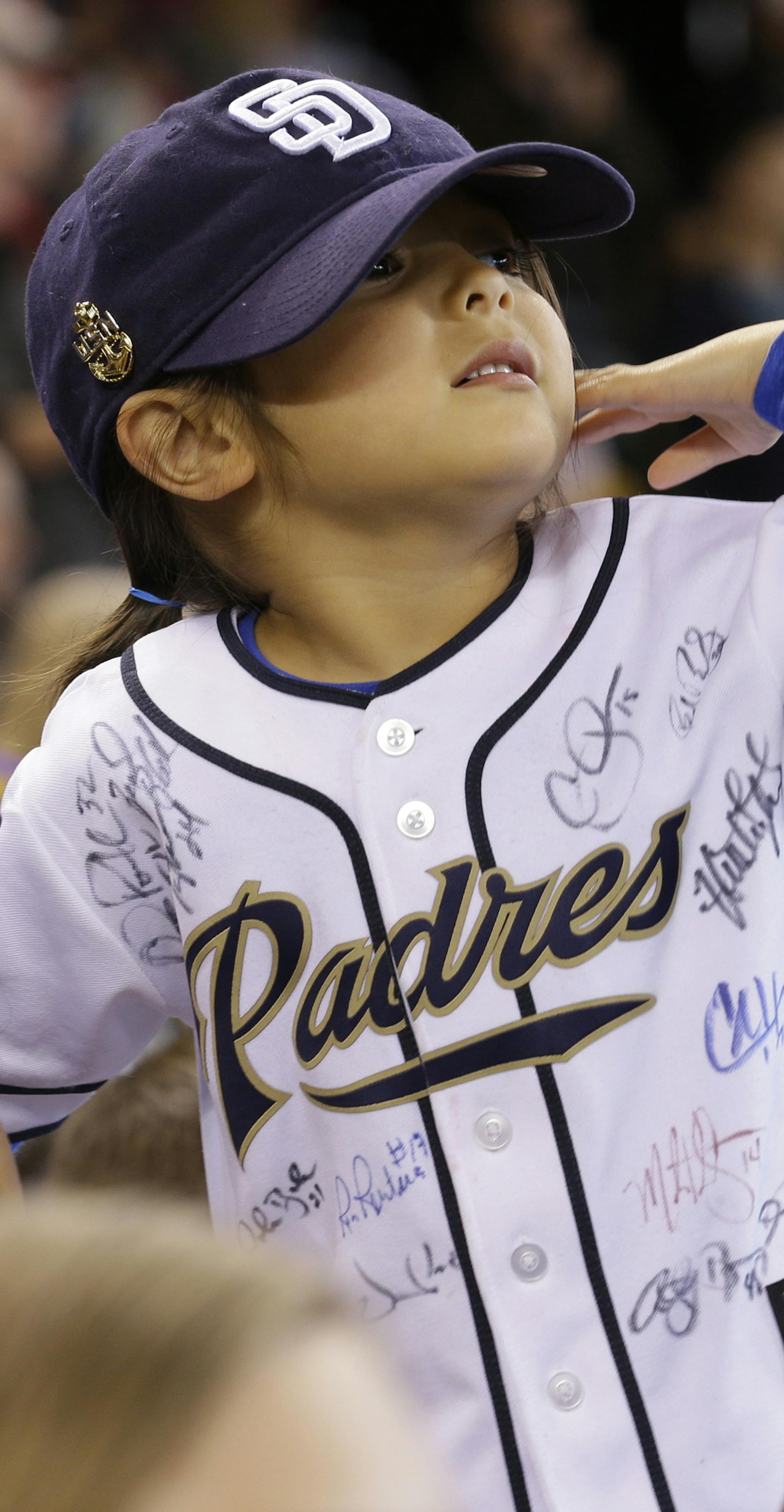 A young San Diego Padres fan wears an autographed jersey during a baseball game against the Seattle Mariners, Monday, May 27, 2013, in Seattle. (AP Photo/Ted S. Warren) ORG XMIT: OTK