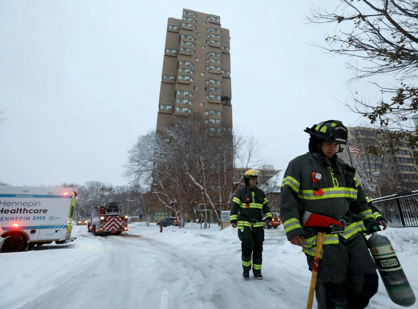 Residents of a south Minneapolis high rise were evacuated early Wednesday after a fire broke out on the 14th floor of the building, killing five people. Here, Minneapolis firefighters leave Wednesday, Nov. 27, 2019, in Minneapolis, MN.