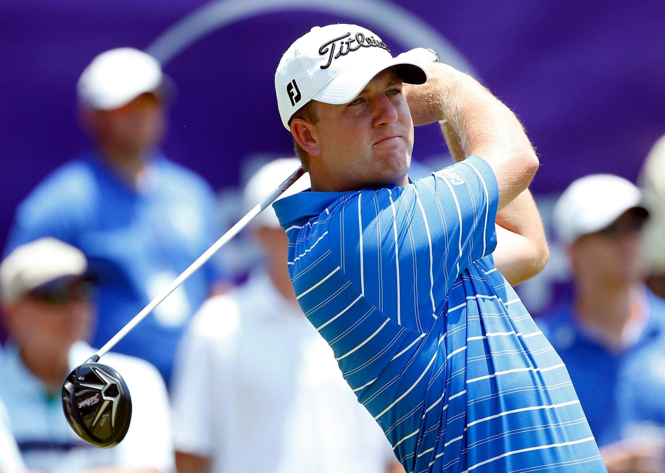 Tom Hoge watches his tee shot on the first tee of the third round of the FedEx St. Jude Classic Golf Tournament, Saturday, June 11, 2016, in Memphis, Tenn. (AP Photo/Rogelio V. Solis)