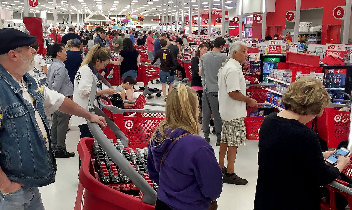 Shoppers wait for cash registers to come back online after a nationwide outage and seen Saturday, June 15, 2019, at Midway Target in St. Paul, MN.] Freelance by Jack Branby Cash registers at Target stores appear to be down nationwide, according to widespread reactions from shoppers on social media.