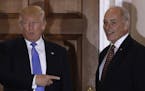 FILE - In this Nov. 20, 2016 file photo, President-elect Donald Trump talks to media as he stands with retired Marine Gen. John Kelly, at the Trump Na