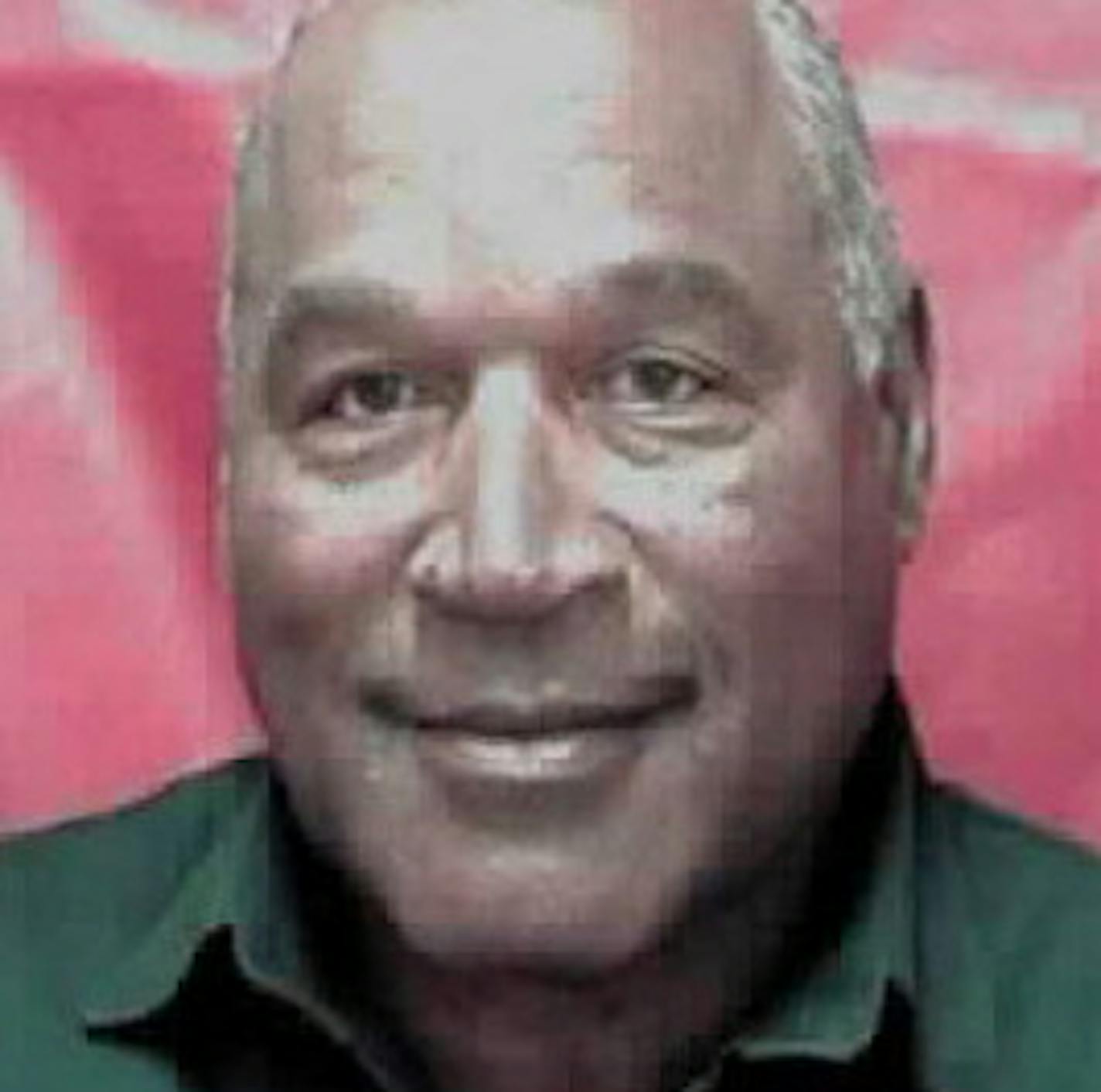 This photo provided by the Nevada Department of Corrections shows O.J. Simpson. Prison officials in Nevada have released a new photo that shows a smiling Simpson. He is serving a sentence of nine to 33 years in a Nevada prison for a 2007 armed robbery and kidnapping conviction. He is eligible for parole next year. (Nevada Department of Corrections via AP)