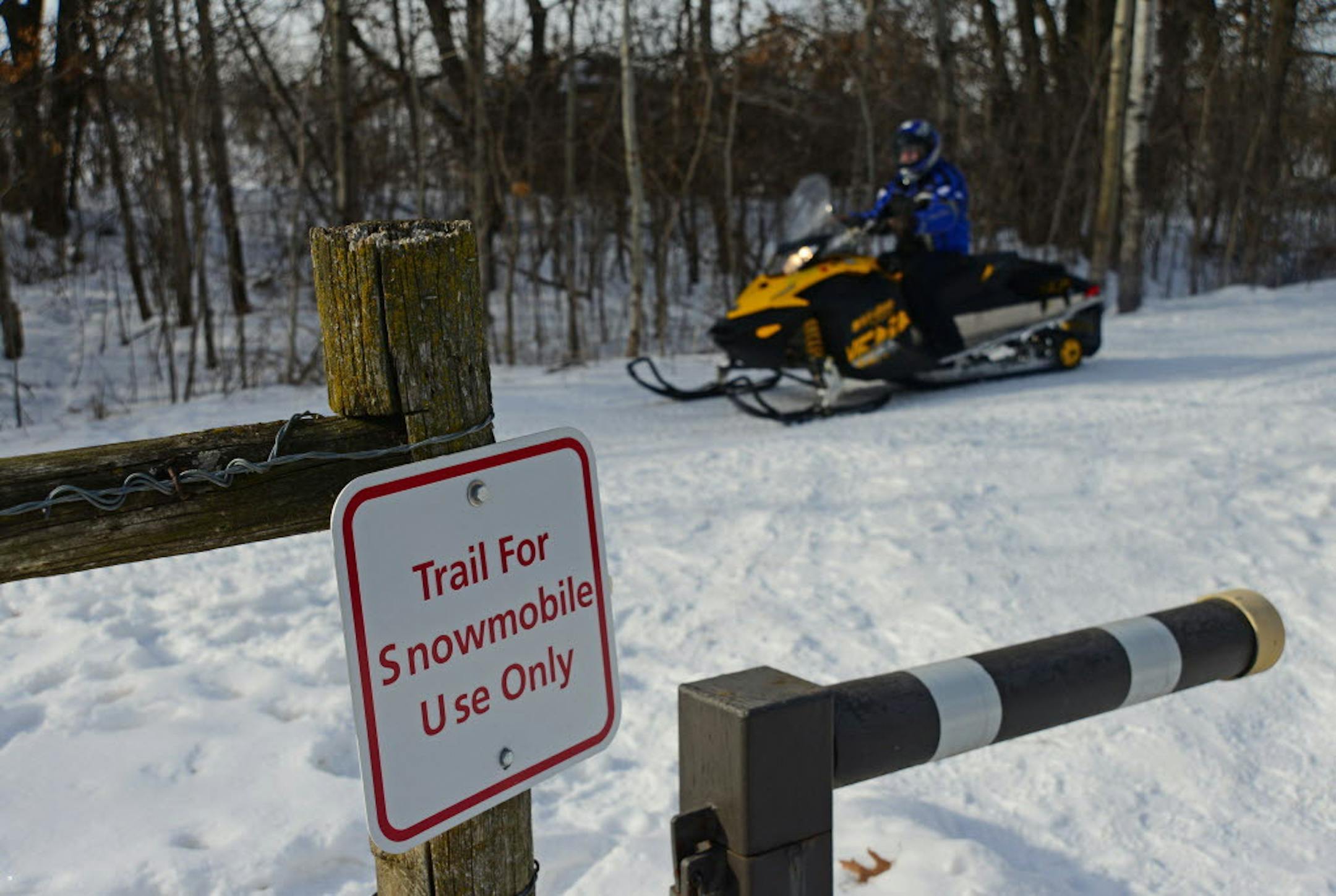 Richard Sennott A snowmobiler drove by on a trail near residents' houses on the edge of Murphy-Hanrehan Park Reserve in Scott County. Conflicts between walkers and snowmobilers led to a meeting on Saturday (3/2) where all sides tried to sort things out.