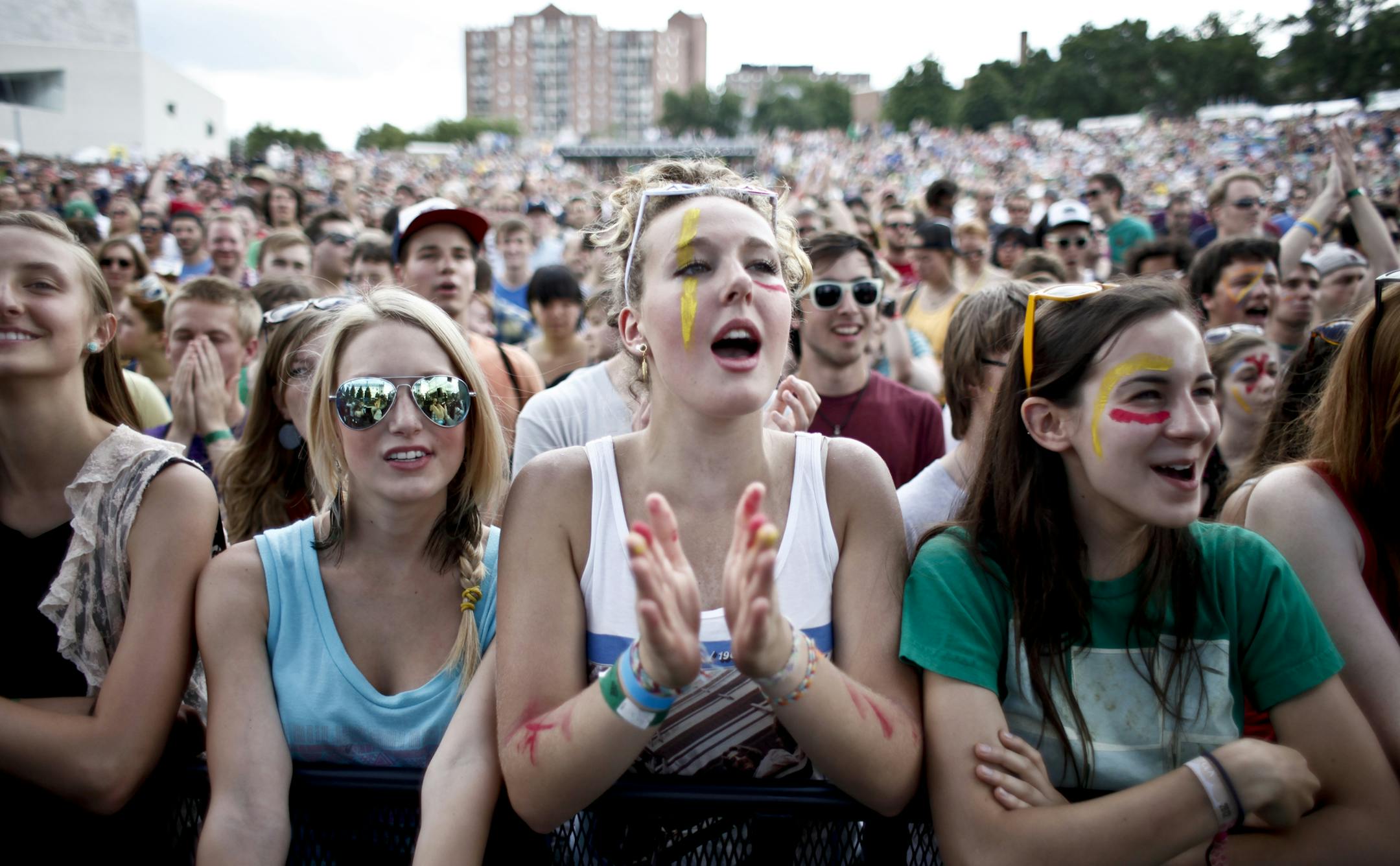 Megan Pohle, 16, middle reacts to the lead singer of Tune-yards Merrill Garbus as she enters the stage to set tone of the 2012 Rock the Garden concert in Minneapolis, Minn. on Saturday, June 16, 2012.] MEGAN TAN/ STAR TRIBUNE‚Ä¢megan.tan@startribune.com. NOTES: she came with her friend, right, Felicia Ceurvorst. ORG XMIT: MIN2013060708342907