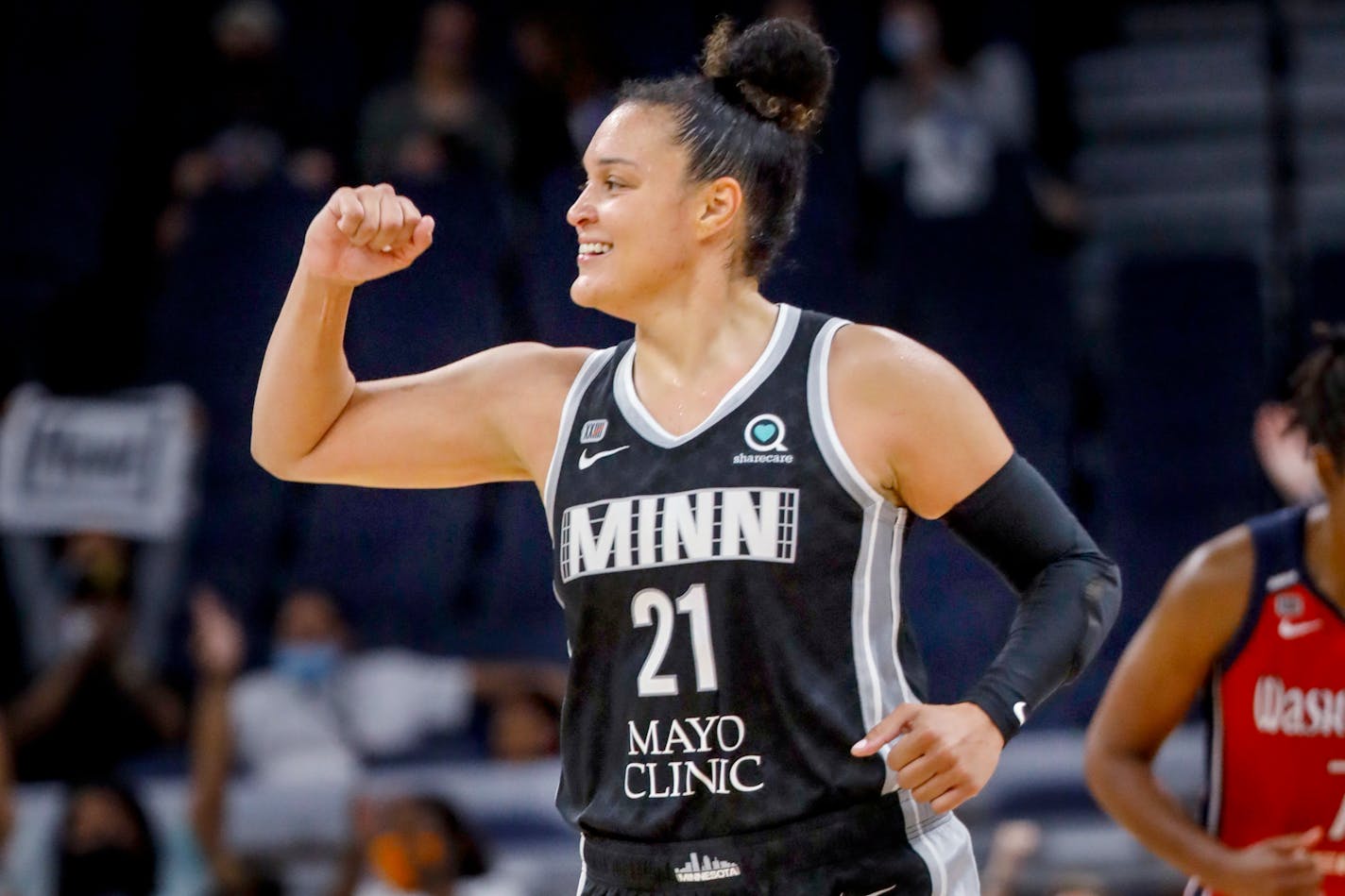 Minnesota Lynx guard Kayla McBride (21) celebrates her three point basket against the Washington Mystics in the fourth quarter of a WNBA basketball game Saturday, Sept. 4, 2021, in Minneapolis. The Lynx won 93-75. (AP Photo/Bruce Kluckhohn)