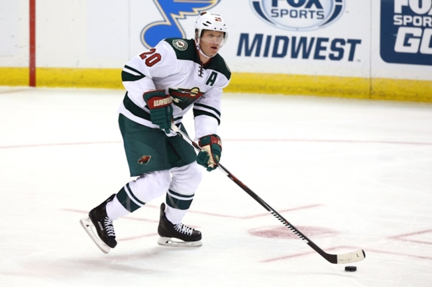 Oct 13, 2016; St. Louis, MO, USA; Minnesota Wild defenseman Ryan Suter (20) skates with the puck during the third period against the St. Louis Blues at Scottrade Center. The Blues won the game 3-2. Mandatory Credit: Billy Hurst-USA TODAY Sports