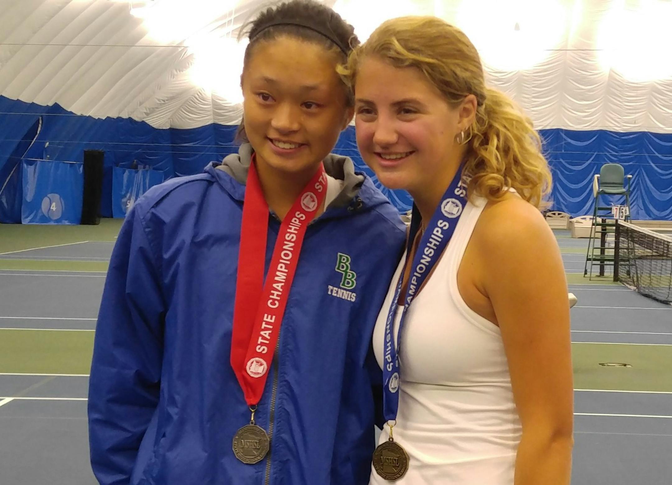 Blake teammates Arlina Shen and Lainey Axell posed with their medals. Axell defeated Shen for the Class 1A singles championship.
