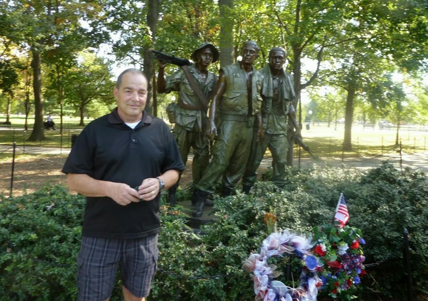 Don St. Dennis, a veteran of business and the Vietnam War, is one of many Vietnam War combat vets suffering from organ failure and related illness due to American spraying of the chemical defoliant called "Agent Orange." Pictured at the Vietnam War Memorial in Washington D.C.