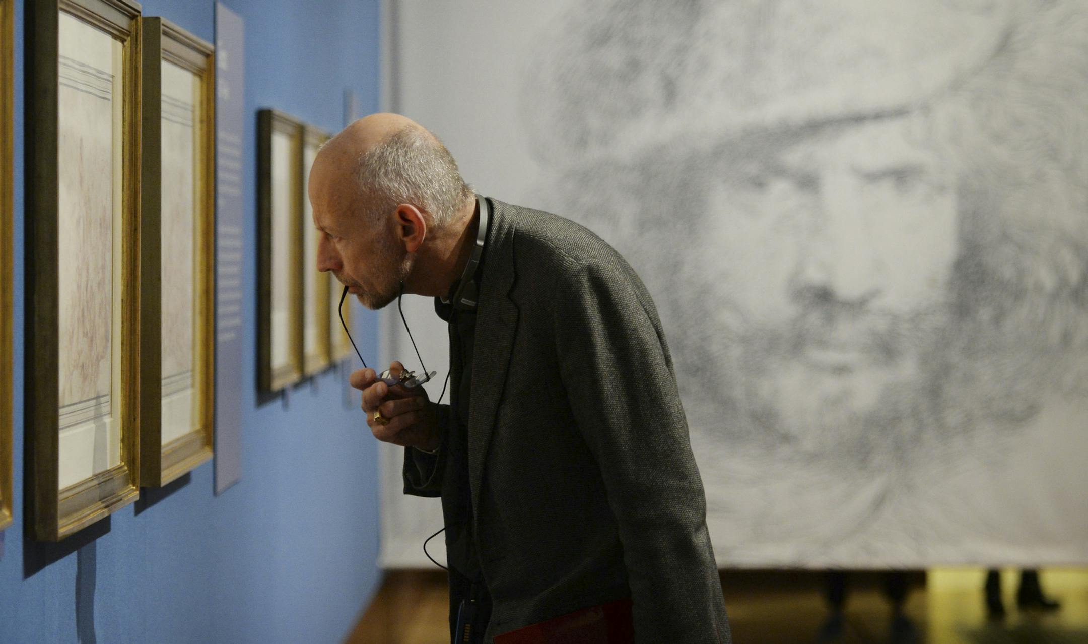 A visitor looks at displayed works by the 17th Century Italian Baroque artist Giovanni Benedetto Castiglione which go on show at the Queen's Gallery in Buckingham Palace, London, Wednesday Oct. 30, 2013. The art works from the Royal Collection form one of the largest groups of works by Castiglione, who is known for painting, printmaking, draftsmanship and inventor of the monotype printmaking technique. (AP Photo / Stefan Rousseau, PA) UNITED KINGDOM OUT - NO SALES - NO ARCHIVES